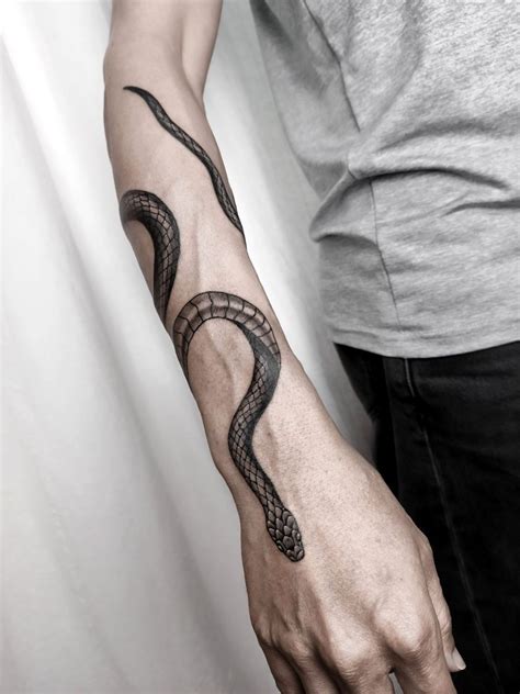 snake wrapped around arm tattoo|Snake Arm Tattoo Ideas for a Fierce Look